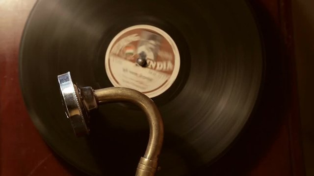 vintage gramophone plays a record