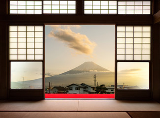 Traditional Japanese indoor  house and paper sliding doors and tatami mat open to View of a...