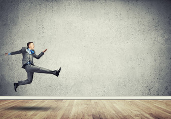 Businessman jumping high