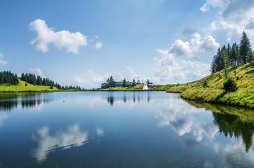 Fototapeta premium Hintersteinersee mountain lake, summer wellness attraction in Scheffau am Wilden Kaiser, Tirol, Austria