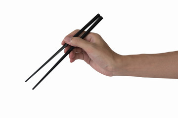 man's hand holding black plastic chopsticks isolated on white background
