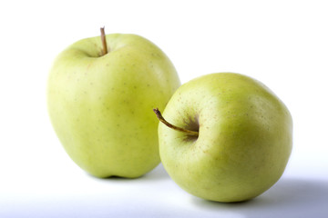 two green apples on the white background