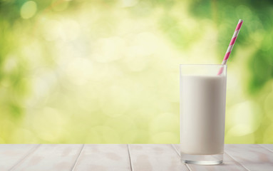 A glass of milk on a natural background