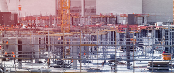workers on construction site of new building
