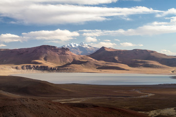 Fototapeta na wymiar Lago Morejon with Volcano Uturuncu in the background at the altiplano in Bolivia