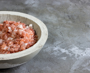 Himalayan pink salt in a concrete bowl