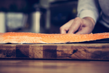 Filleting salmon.