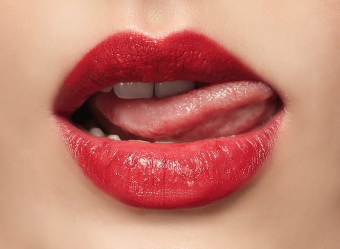 Young woman with red lips, close up