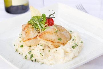 Risotto with chicken served in a restaurant.