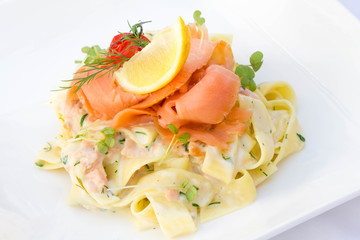 Salmon with pasta served in a restaurant