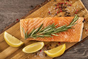 Delicious portion of fresh salmon fillet with aromatic herbs