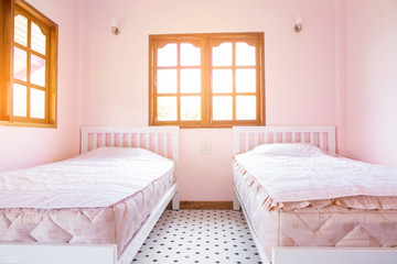 pink bedroom with two bed