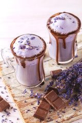 Cappuccino with lavender and chocolate syrup and flowers