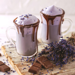 Cappuccino with lavender and chocolate syrup and flowers