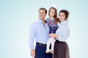 Happy parents with a small daughter.