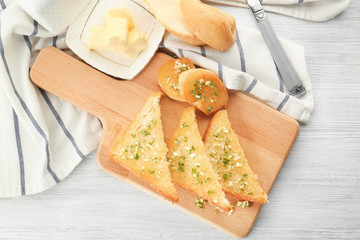 Garlic French bread slices on wooden board