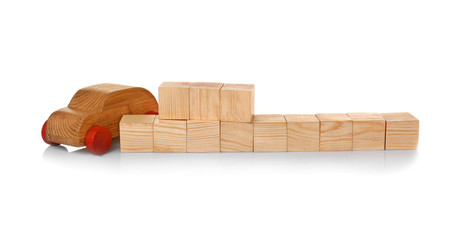 Cubes with space for text and wooden toy car on white background