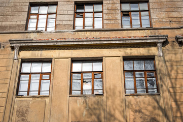 Old abandoned building. Ruined school. Destroyed construction.