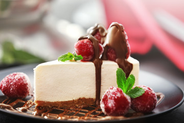 Tasty cheesecake slice with berries on plate