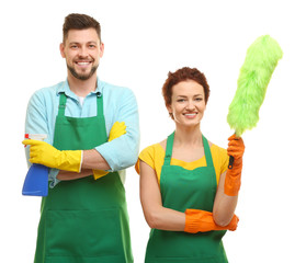 Couple with cleaning supplies on white background