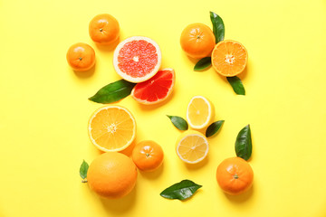 Juicy composition of tropical fruits on yellow background