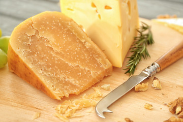 Cutting board with cheese and special knife, closeup