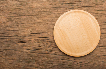 empty wooden plate  wood texture background can use to pizza on plate and copy space etc.;