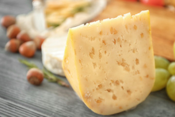Piece of cheese with seeds, closeup