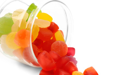 Jar with tasty jelly candies on white background, closeup