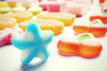Tasty jelly candies on light background, closeup