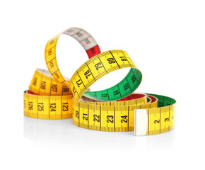 Diet concept. Color measuring tape on white background