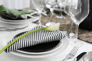 Dishware with floral decoration on table