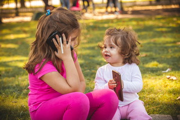 Fototapeta premium portrait latin sisters in summer park 