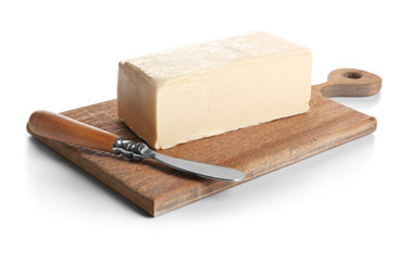 Board with butter and shovel on white background, closeup
