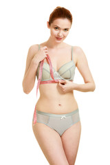Obraz premium Woman measuring her under breasts.