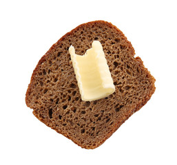 Slice of bread with butter curl on white background