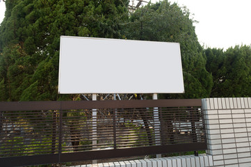 Large blank billboard on a street wall, banners with room to add your own text