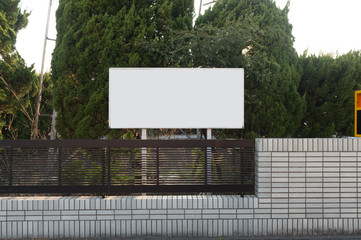 Large blank billboard on a street wall, banners with room to add your own text
