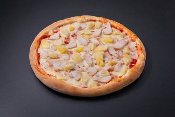 Pizza with cheese and pineapple chicken on board 2