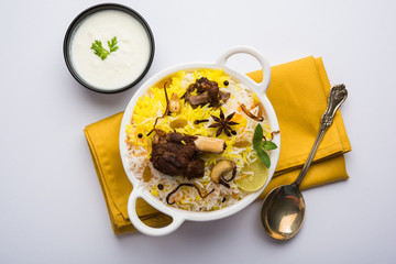 kashmiri or hyderabadi Mutton Gosht Biryani / Lamb Biryani / Mutton Biryani served with Yogurt dip,...
