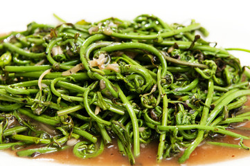 Closeup of stir fry Midin vegetable