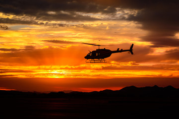 Fototapeta na wymiar Bell 206 at sunset