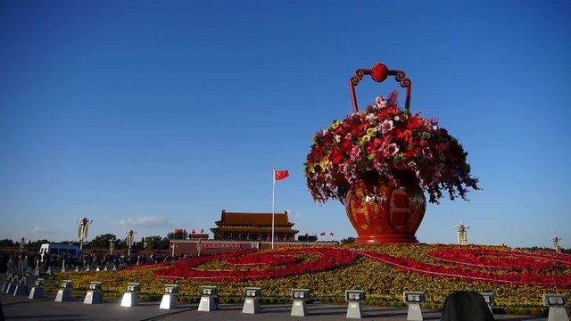 gorgeous baskets full of flowers in blue sky.Beijing Tiananmen Square sunny.