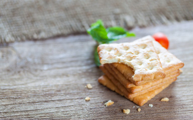 Crackers or biscuit on wooden background