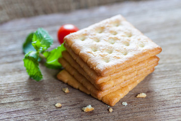 Crackers or biscuit on wooden background