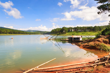 Obraz na płótnie Canvas Fishing net in Tuyen Lam lake in Dalat, Lam Dong, Vietnam. Tuyen Lam lake is artificial lake, 6km to the South of Dalat, has the water surface of 350 hectare.