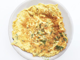 Thai omelette (fried egg) on dish and white background