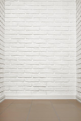 Fototapeta premium white brick wall with tiled floor, abstract background photo