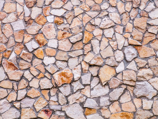 The stone wall of the house. Texture, background.