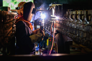 Welding steel structures and bright sparks in steel construction industry.